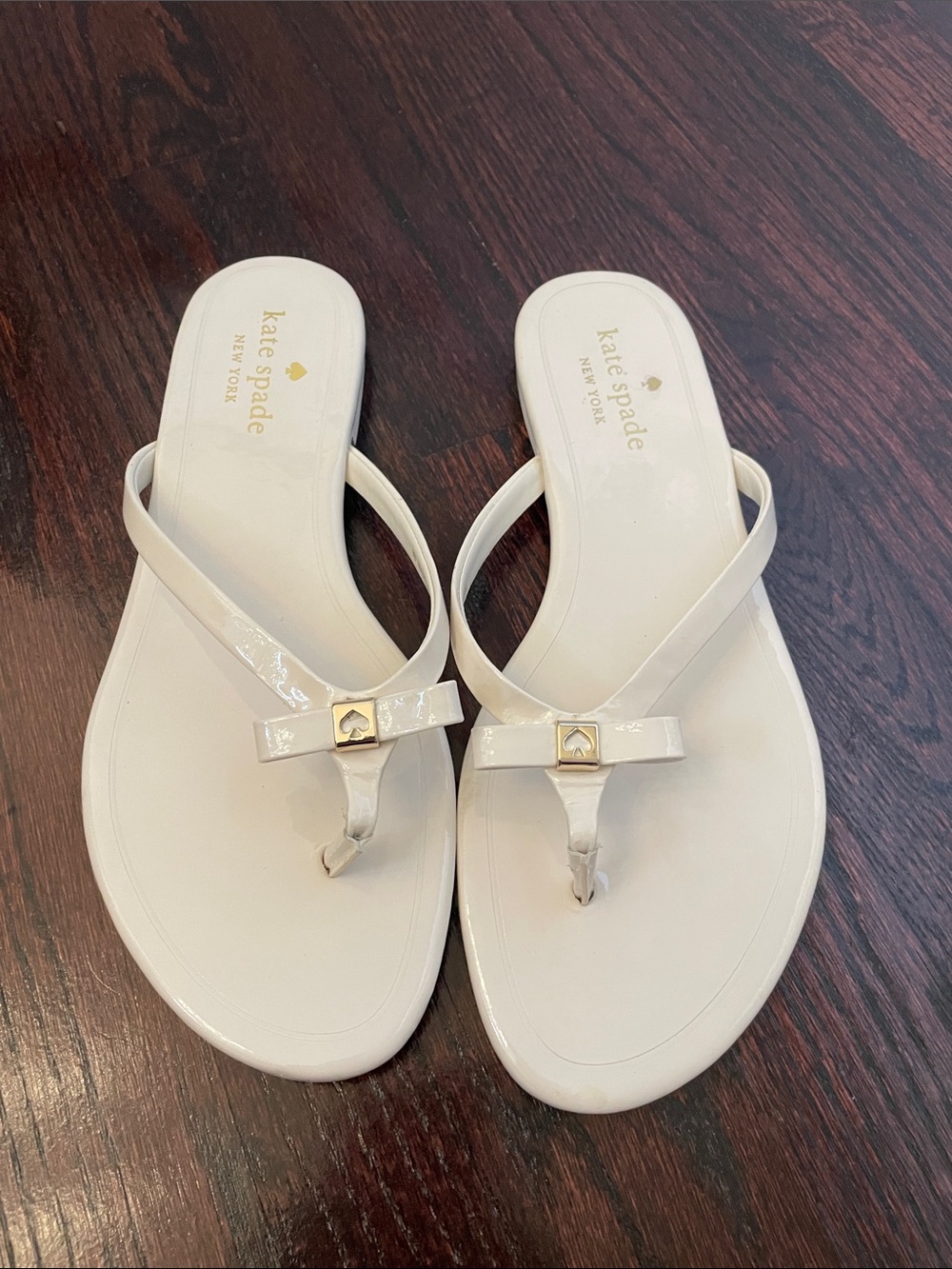 kate spade White Patent Bow Thong Sandals with Gold Accent